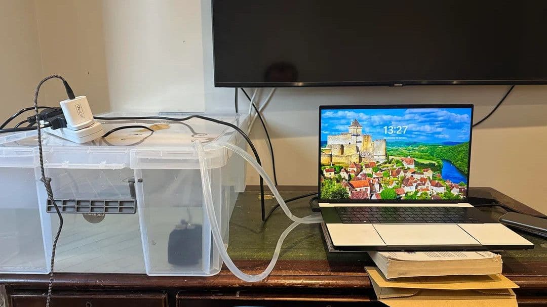 Razer Blade 16 gaming laptop is brought back to life with giant cooling solution made from a storage crate, avoiding a massive repair bill